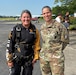 Nicole Gossman (left), an educator at Shortridge High School in Indiana shares an excited smile and poses for a photograph with 3rd Recruiting Brigade Commander, Colonel Whitney Jensen, prior to boarding the plane and experiencing a Tandem Skydive with the U.S. Army Golden Knights Parachute Team.