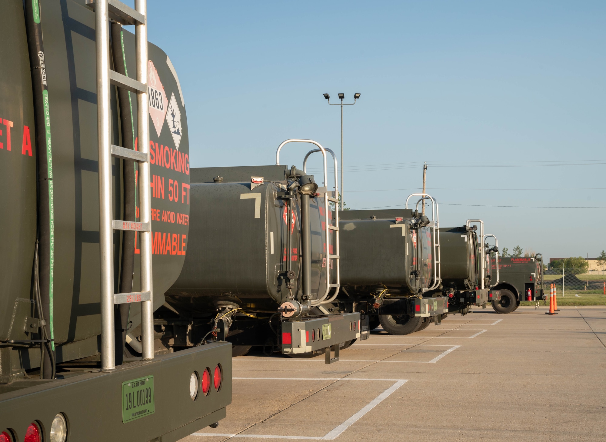 A line of C-300 mobile fuel vehicles are parked at the 5th Logistics Readiness Squadron petroleum, oil and lubricant flight’s parking area at Minot Air Force Base, North Dakota, June 24, 2025. A C-300 mobile fuel vehicle is capable of carrying 1,200 gallons of fuel and can dispense 80 gallons of fuel per minute. (U.S. Air Force photo by Airman 1st Class Wesley Davies)