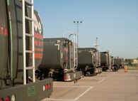 A line of C-300 mobile fuel vehicles are parked at the 5th Logistics Readiness Squadron petroleum, oil and lubricant flight’s parking area at Minot Air Force Base, North Dakota, June 24, 2025. A C-300 mobile fuel vehicle is capable of carrying 1,200 gallons of fuel and can dispense 80 gallons of fuel per minute. (U.S. Air Force photo by Airman 1st Class Wesley Davies)