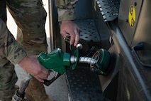 An Airman from the 5th Munitions Squadron (5MUNS) refuels a fork lift with a C-300 mobile fuel vehicle during a 5MUNS capability exercise (CAPEX) at Minot Air Force Base, North Dakota, June 24, 2025. During the CAPEX, forklifts were able to move the munitions safely and efficiently because of the fuel provided by the 5th Logistics Readiness Squadron petroleum, oil and lubricant flight. (U.S. Air Force photo by Airman 1st Class Wesley Davies)