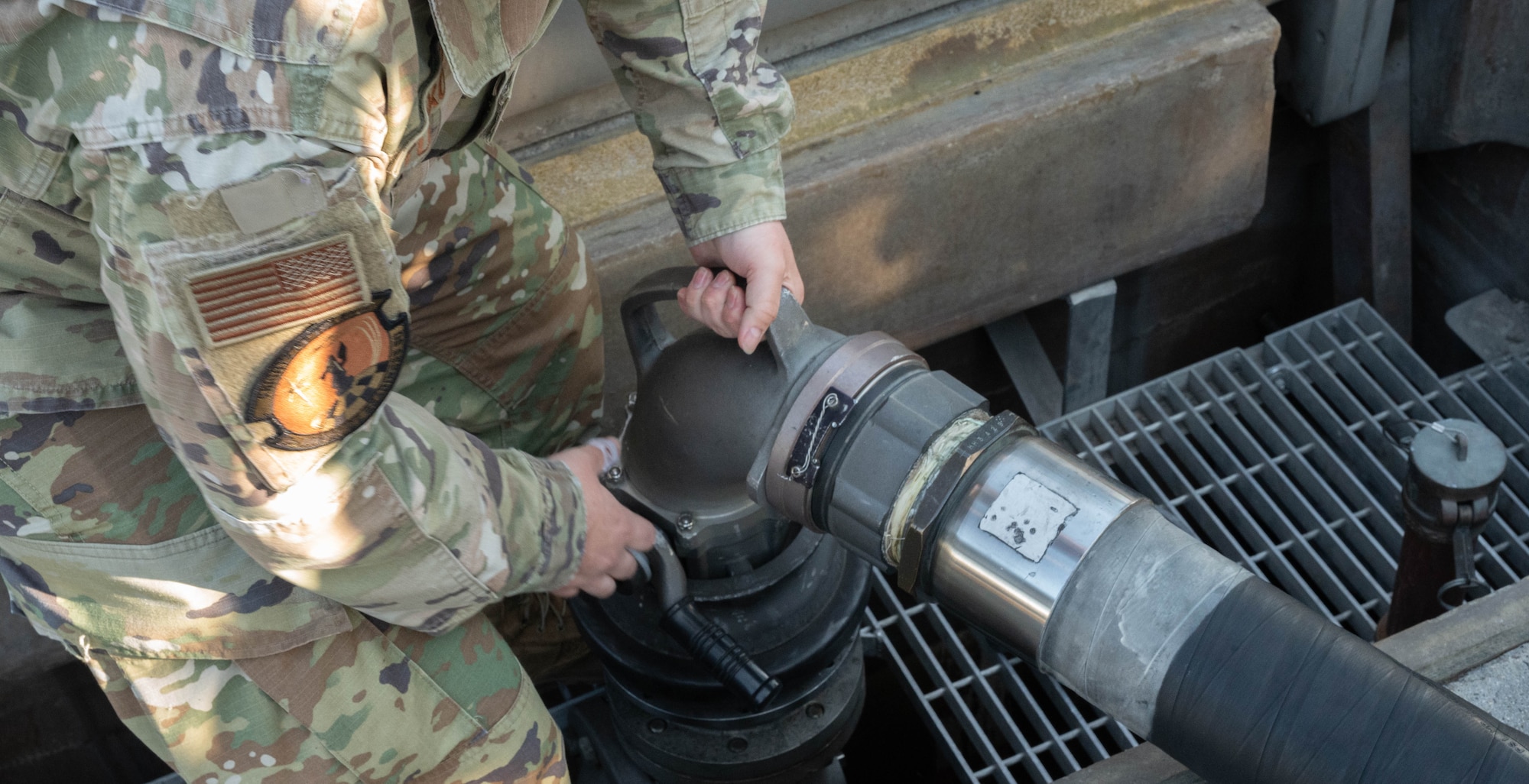 Senior Airman Tristan Turkovitz, 5th Logistics Readiness Squadron petroleum, oil and lubricant flight fuels expeditor, detaches an R-12 hydrant refueling truck fuel pump hose from a type III hydrant system after defueling a B-52H Stratofortress at Minot Air Force Base, North Dakota, June 24, 2025. The R-12 hydrant refueling truck is capable of displacing 1,000 gallons of fuel per minute through two platform hoses to either refuel or defuel an aircraft. (U.S. Air Force photo by Airman 1st Class Wesley Davies)