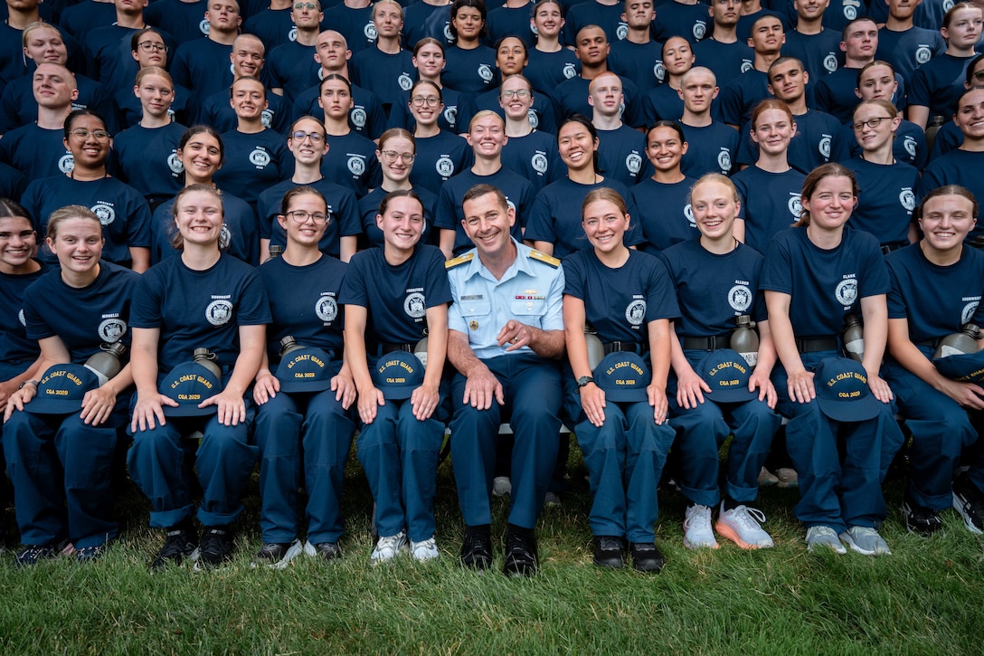 U.S. Coast Guard Rear Adm. Gregory Rothrock poses for a photo with members of the U.S. Coast Guard Academy (USCGA) Class of 2029 during Day One at USCGA, New London, Connecticut, June 30, 2025. Day One marks the start of Swab Summer, an intensive seven-week program that prepares students for military and Academy life. (U.S. Coast Guard photo by Petty Officer 3rd Class Matt Thieme)
