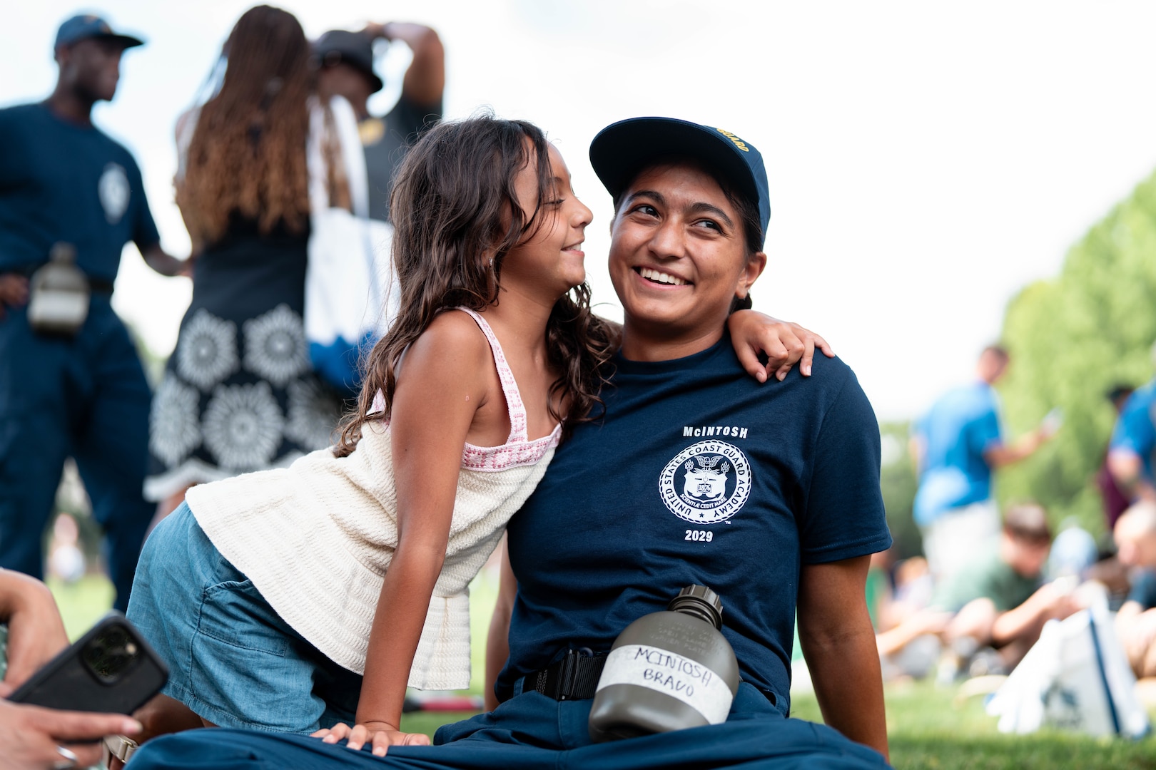 A U.S. Coast Guard Academy (USCGA) swab from the Class of 2029 embraces a loved one during Day One at USCGA, New London, Connecticut, June 30, 2025. The new Class of 2029 are given 15 minutes to say goodbye to their families before they enter the seven-week training environment. (U.S. Coast Guard photo by Petty Officer 3rd Class Matt Thieme.)