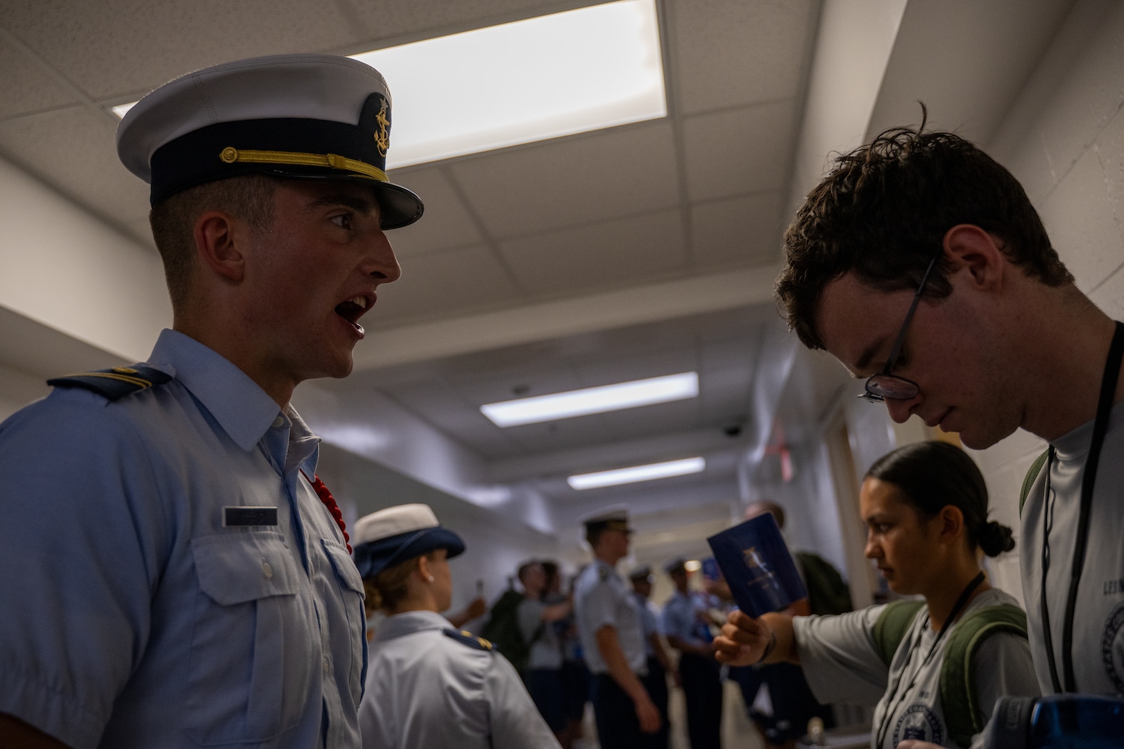 U.S. Coast Guard Academy (USCGA) cadet cadre give orders to the incoming Class of 2029 swabs during Day One at USCGA, New London, Connecticut, June 30, 2025. Day One marks the beginning of a seven-week training program that transforms swabs into cadets. (U.S. Coast Guard photo by Petty Officer Third Class Leo Avila.)