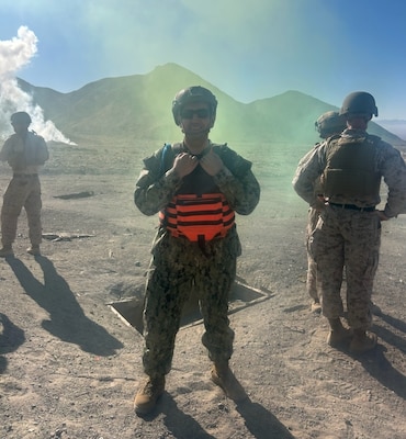 Lt. Christopher Barajas observes a live-fire range during Integrated Training Exercise (ITX) at Marine Corps Air Ground Combat Center Twentynine Palms on June 15. The experience provided Barajas, an audiologist, with a clearer understanding of the noise exposure service members face during training and helped inform his approach to hearing evaluations and audiograms (Courtesy photo).