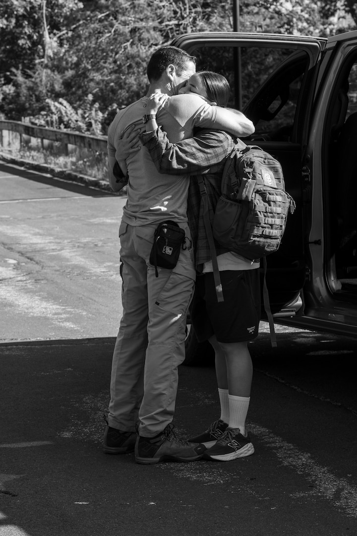U.S. Coast Guard Academy (USCGA) swab from the Class of 2029 embraces a loved one during Day One at USCGA, New London, Connecticut, June 30, 2025. The new Class of 2029 are given 15 minutes to say goodbye to their families before they enter the seven-week training environment. (U.S. Coast Guard photo by Petty Officer Second Class Janessa Warschkow.)