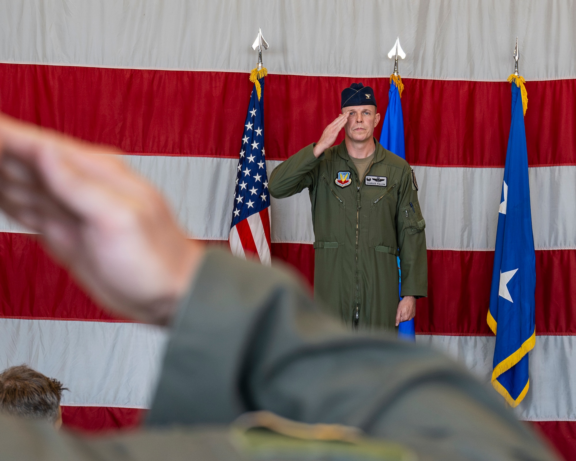 A photo of a commander saluting the troops