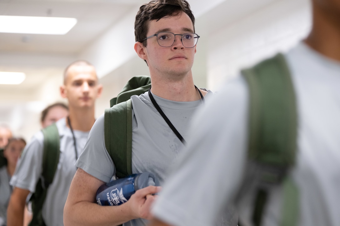 U.S. Coast Guard Academy (USCGA) Class of 2029 stand in line during Day One at USCGA, New London, Connecticut, June 30, 2025. Day One is the start of Swab Summer, an intensive seven-week program that transforms swabs into cadets. (U.S. Coast Guard photo by Petty Officer Second Class Janessa Warschkow.)
