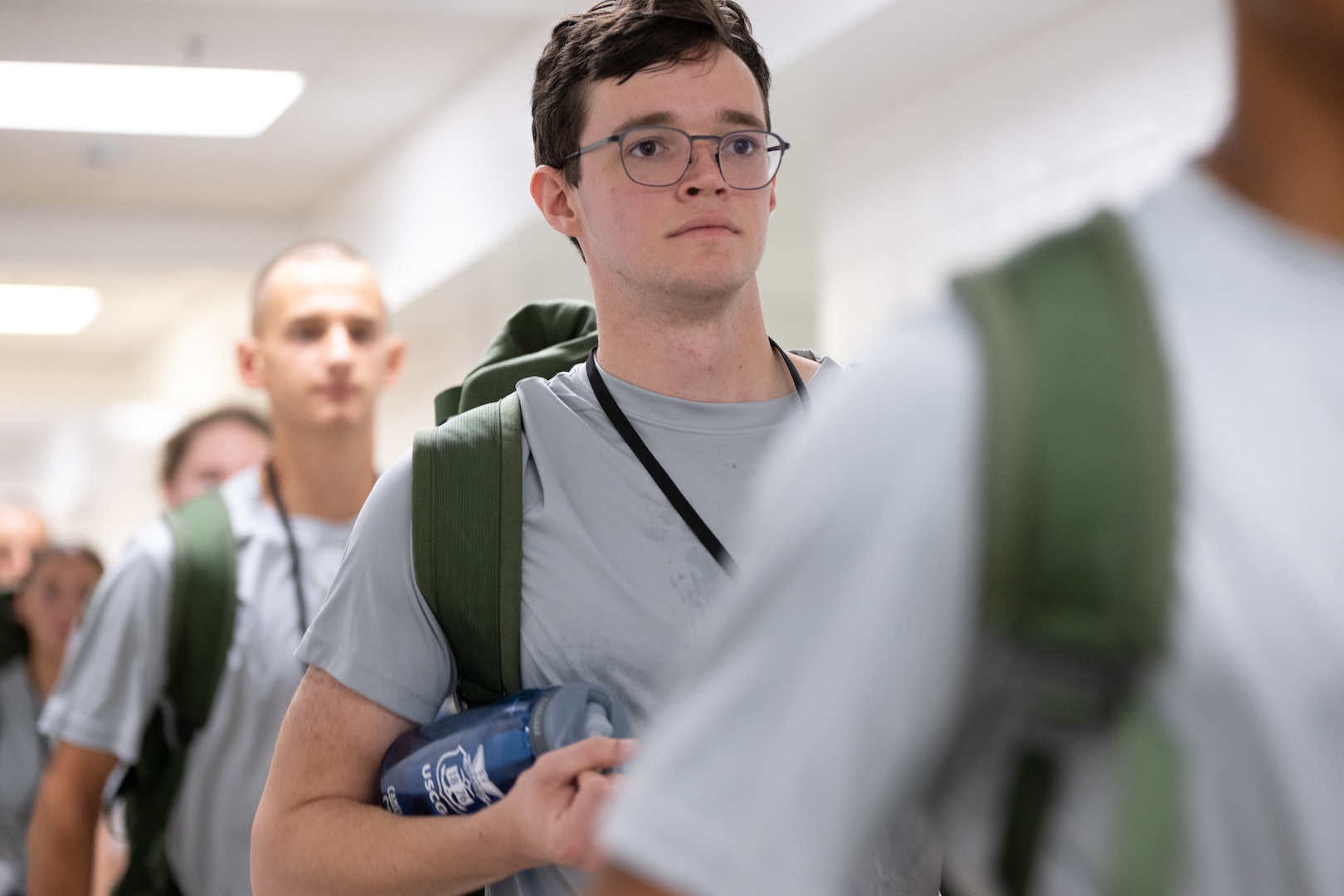 U.S. Coast Guard Academy (USCGA) Class of 2029 stand in line during Day One at USCGA, New London, Connecticut, June 30, 2025. Day One is the start of Swab Summer, an intensive seven-week program that transforms swabs into cadets. (U.S. Coast Guard photo by Petty Officer Second Class Janessa Warschkow.)