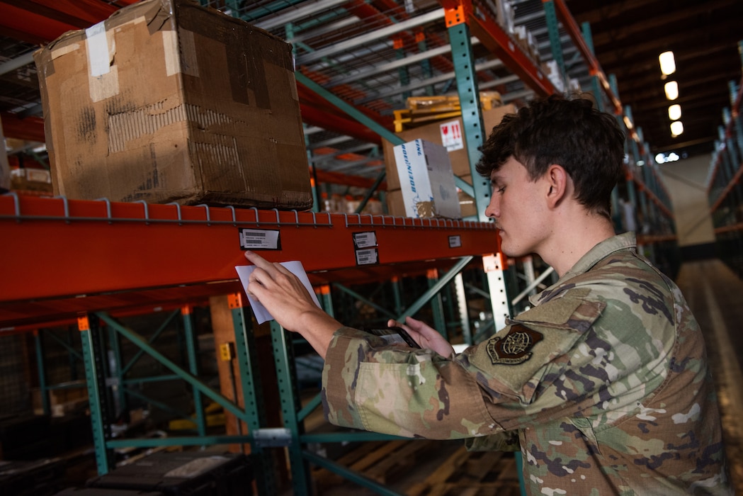 Airman searches for item on shelf