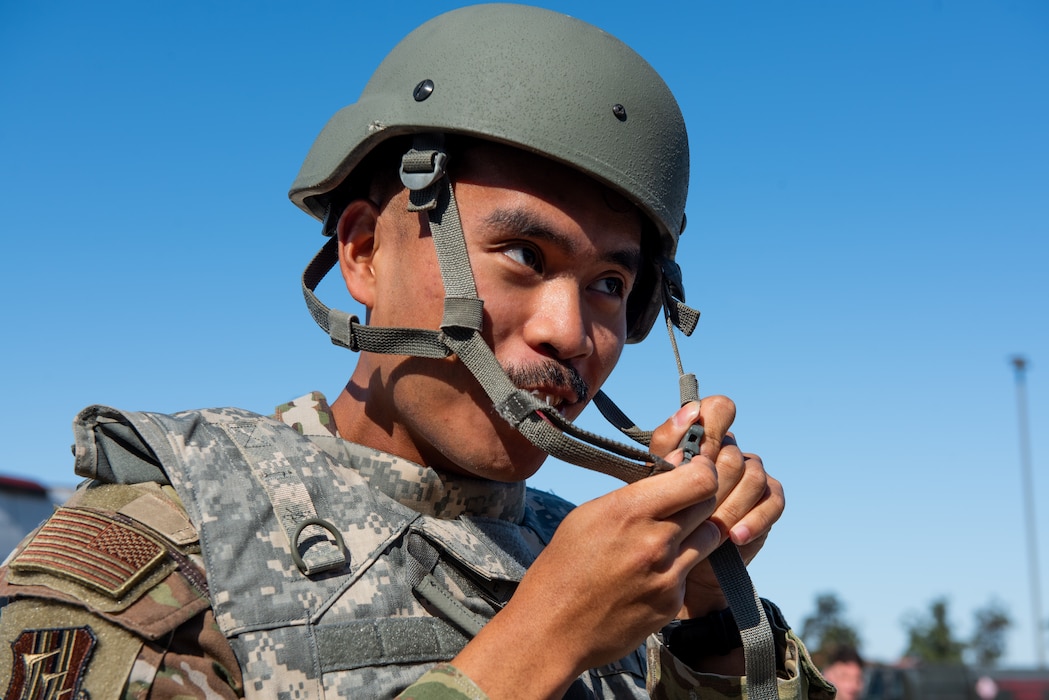 Airman dons helmet