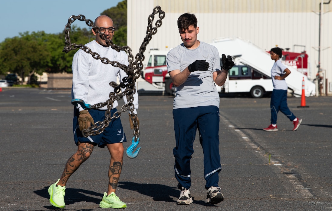 Airmen throw a chain
