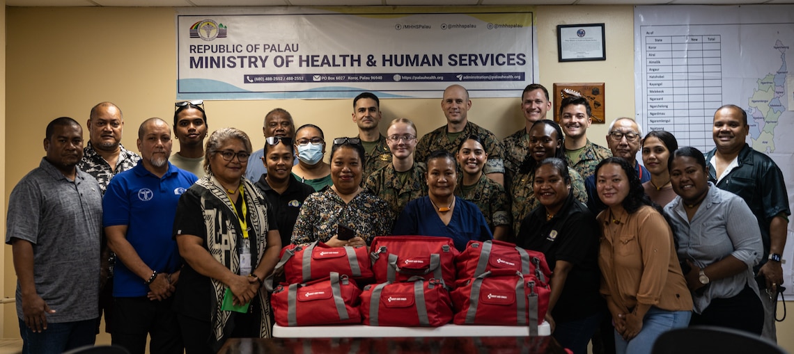 U.S. Marines and Sailors with Combat Logistics Battalion 15, Combat Logistics Regiment 17, 1st Marine Logistics Group, pose for a photo with medical staff and members of the Ministry of Health and Human Services during Koa Moana 25 at Belau National Hospital in Palau, June 26, 2025. Koa Moana 25 is an annual partnership in the Indo-Pacific region that strengthens established relationships, bolsters theater security cooperation, and enhances the resilience of our allies and partners through community outreach, medical and civic assistance, infrastructure improvement projects, and key leader exchanges. (U.S. Marine Corps photo by Cpl. Ryan Ramsammy)