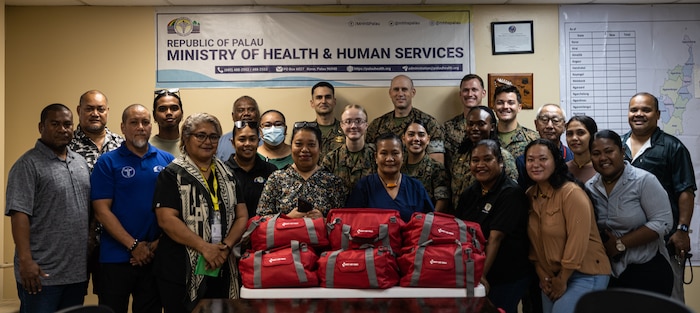 U.S. Marines and Sailors with Combat Logistics Battalion 15, Combat Logistics Regiment 17, 1st Marine Logistics Group, pose for a photo with medical staff and members of the Ministry of Health and Human Services during Koa Moana 25 at Belau National Hospital in Palau, June 26, 2025. Koa Moana 25 is an annual partnership in the Indo-Pacific region that strengthens established relationships, bolsters theater security cooperation, and enhances the resilience of our allies and partners through community outreach, medical and civic assistance, infrastructure improvement projects, and key leader exchanges. (U.S. Marine Corps photo by Cpl. Ryan Ramsammy)