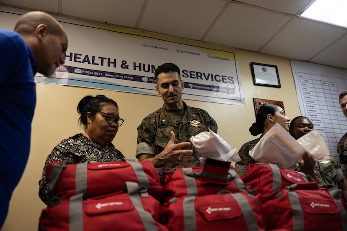 U.S. Navy Lt. Cmdr. Syed Hussain, an emergency medicine physician with Combat Logistics Battalion 15, Combat Logistics Regiment 17, 1st Marine Logistics Group, showcases the contents of the first aid kits to members of the Ministry of Health and Human Services during Koa Moana 25 at Belau National Hospital in Palau, June 26, 2025.