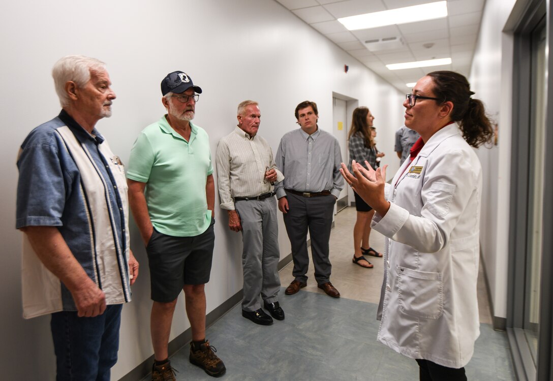 Dr. Katie Whitmore, forensic anthropologist with the Defense POW/MIA Accounting Agency, tours family members of fallen service members through the DPAA laboratory June 25, 2025 at Offutt Air Force Base, Nebraska.
