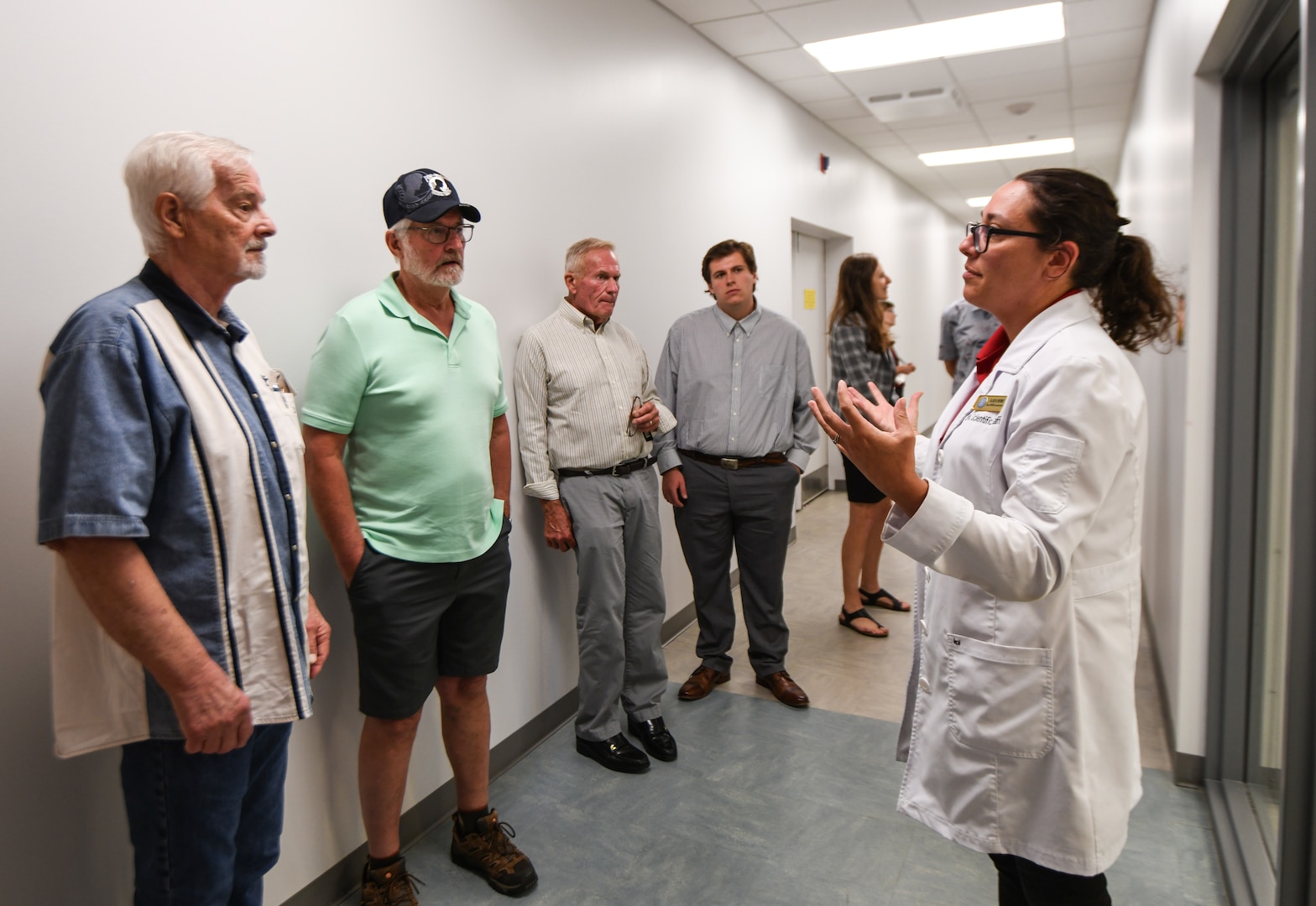 Dr. Katie Whitmore, forensic anthropologist with the Defense POW/MIA Accounting Agency, tours family members of fallen service members through the DPAA laboratory June 25, 2025 at Offutt Air Force Base, Nebraska.