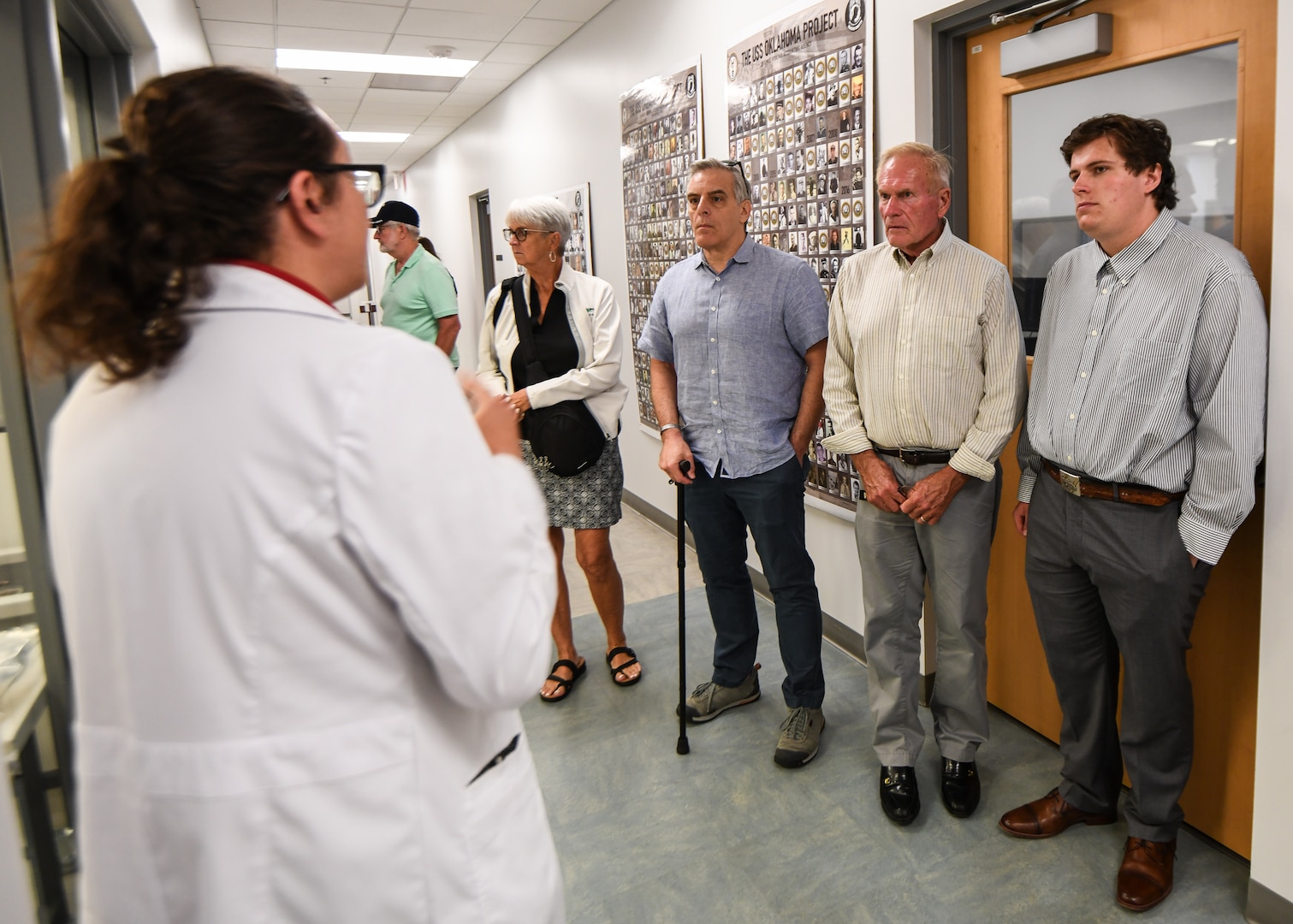 r. Katie Whitmore, forensic anthropologist with the Defense POW/MIA Accounting Agency, speaks to family members of fallen service members during a tour of the DPAA laboratory, June 25, 2025 at Offutt Air Force Base, Nebraska.