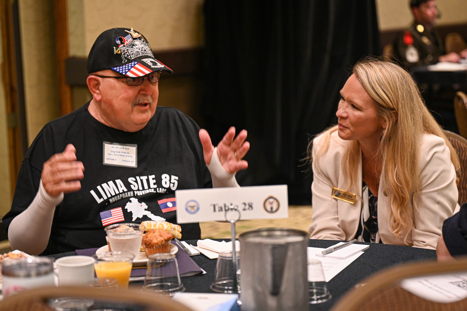 Ashley Conner, Defense POW/MIA Accounting Agency Outreach and Communications deputy director, talks with family members at the Vietnam War Annual Government Briefing, Omaha, Nebraska, June 26, 2025.