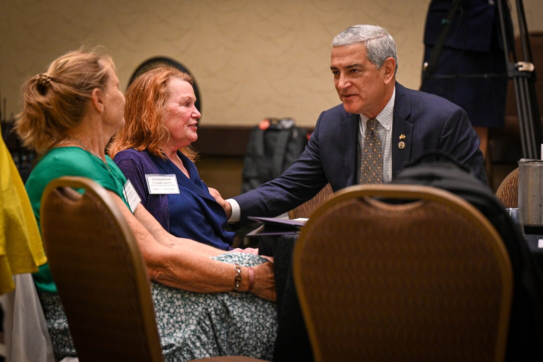 Kelly McKeague, Defense POW/MIA Accounting Agency director, greets family members at the Vietnam War Annual Government Briefing, Omaha, Nebraska, June 26, 2025.