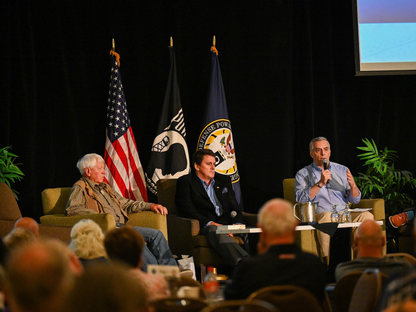 oseph Mortati, right, chief aviation analyst for Healing Through History, Glenn Hines, center, chief executive officer of Healing Through History, and retired U.S. Air Force Col. Ed Sykes, left, give a brief at the Defense POW/MIA Accounting Agency's Vietnam War Annual Government Briefing, Omaha, Nebraska, June 27, 2025.