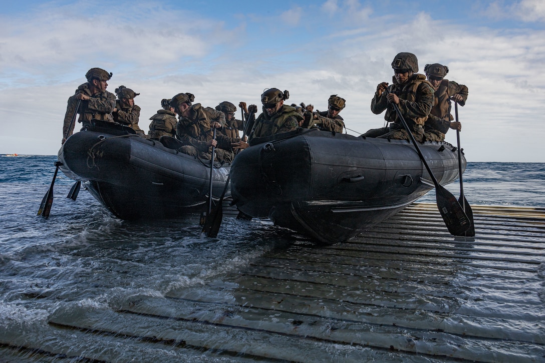 U.S. Marines with Baker Company, Battalion Landing Team 1st Battalion, 7th Marine Regiment, 31st Marine Expeditionary Unit, board the amphibious transport dock USS San Diego (LPD 22) utilizing the Enhanced Combat Rubber Reconnaissance Craft during launch and recovery drills, in the Coral Sea, June 25, 2025. Marines conducted launch and recovery drills in order to improve amphibious raid capabilities and sustain small boat skills. The 31st MEU is operating aboard ships of the USS America Amphibious Ready Group in the 7th Fleet area of operations, the U.S. Navy’s largest forward-deployed numbered fleet, and routinely interacts and operates with allies and partners in preserving a free and open Indo-Pacific region. (U.S. Marine Corps photo by Lance Cpl. Trevor BishopWilliams)