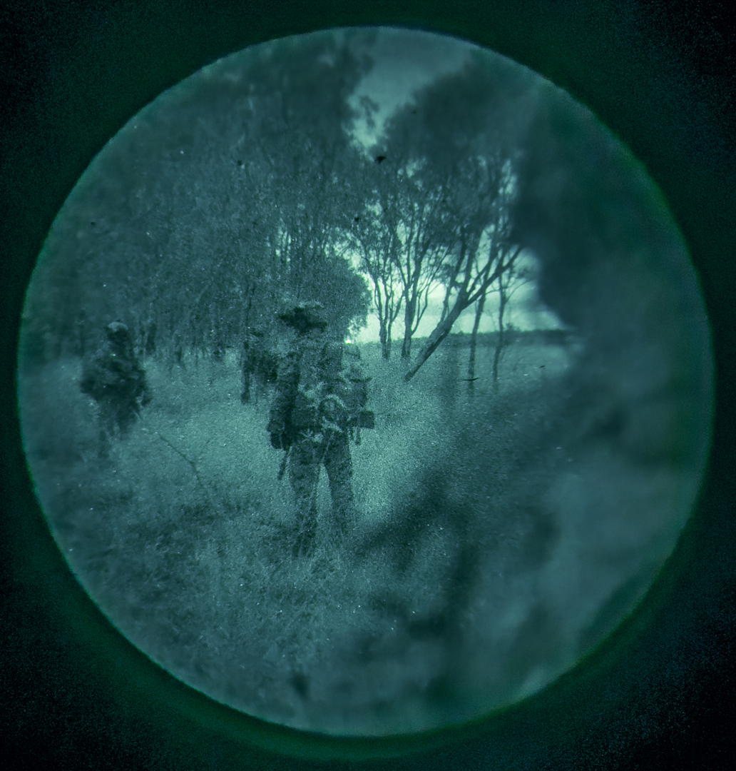 U.S. Marines with Animal Company, Battalion Landing Team 1st Battalion, 7th Marine Regiment, 31st Marine Expeditionary Unit, conduct a patrol through the forest during a simulated night raid at Shoalwater Bay training area, Queensland, Australia, June 26, 2025. The raid simulated employing Marines to rapidly capture and control objectives essential to operations. The 31st MEU is operating aboard the ships of the USS America Amphibious Ready Group in the 7th Fleet area of operations, the U.S. Navy’s largest forward deployed numbered fleet, and routinely interacts and operates with allies and partners in preserving a free and open Indo-Pacific region. (U.S. Marine Corps photo by Lance Cpl. Victor Gurrola)