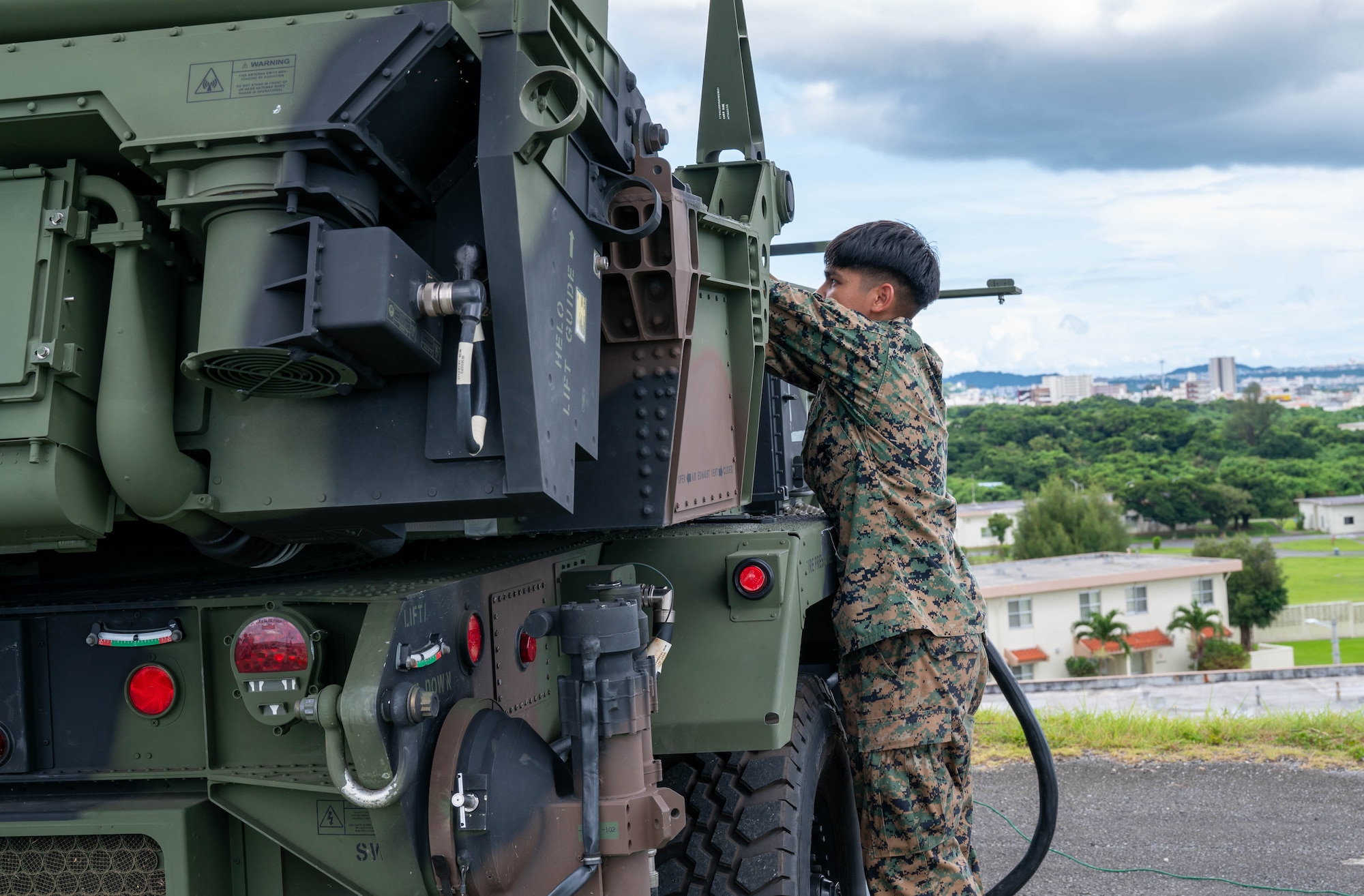 Service member disassembles radar.