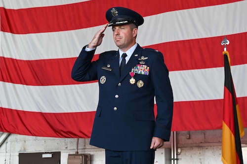 An outgoing commander renders his final salute as the wings commander during a change of command ceremony.