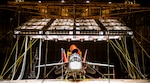 A T-7A Red Hawk sits under bright lights used to create heat in the McKinley Climatic Lab June 16 at Eglin Air Force Base, Florida. The Air Force’s newest training aircraft experienced temperature extremes from 110 to minus 25 degrees Fahrenheit as well as heavy humidity during the month of testing. The tests evaluate how the aircraft, its instrumentation and electronics fared under the extreme conditions it will face in the operational Air Force. (U.S. Air Force photo by Matt Veasley)