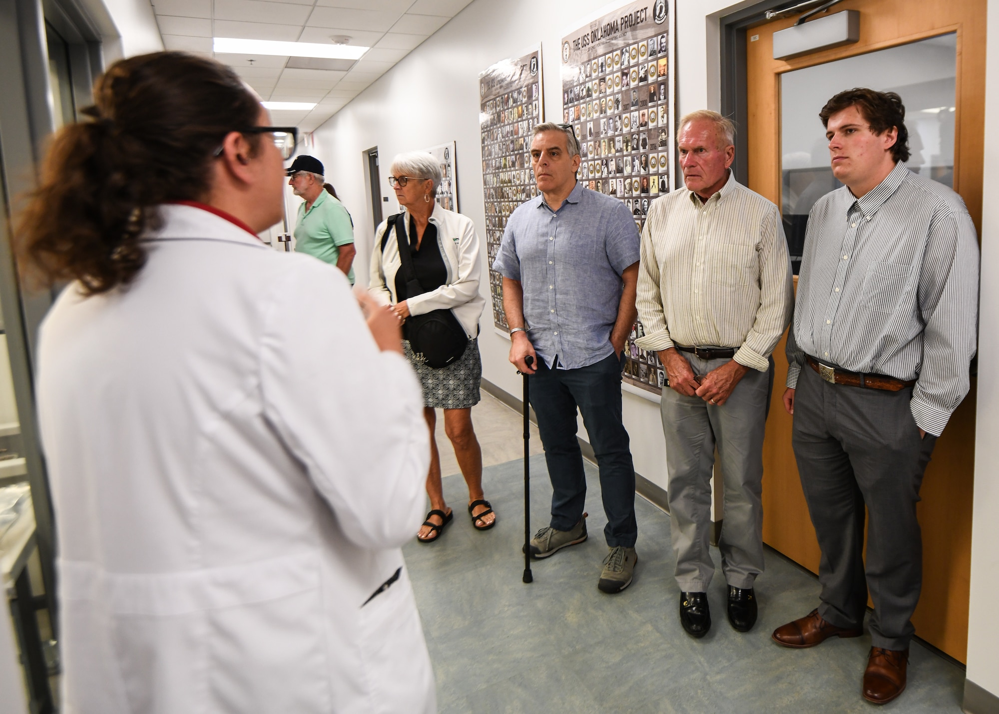 r. Katie Whitmore, forensic anthropologist with the Defense POW/MIA Accounting Agency, speaks to family members of fallen service members during a tour of the DPAA laboratory, June 25, 2025 at Offutt Air Force Base, Nebraska.