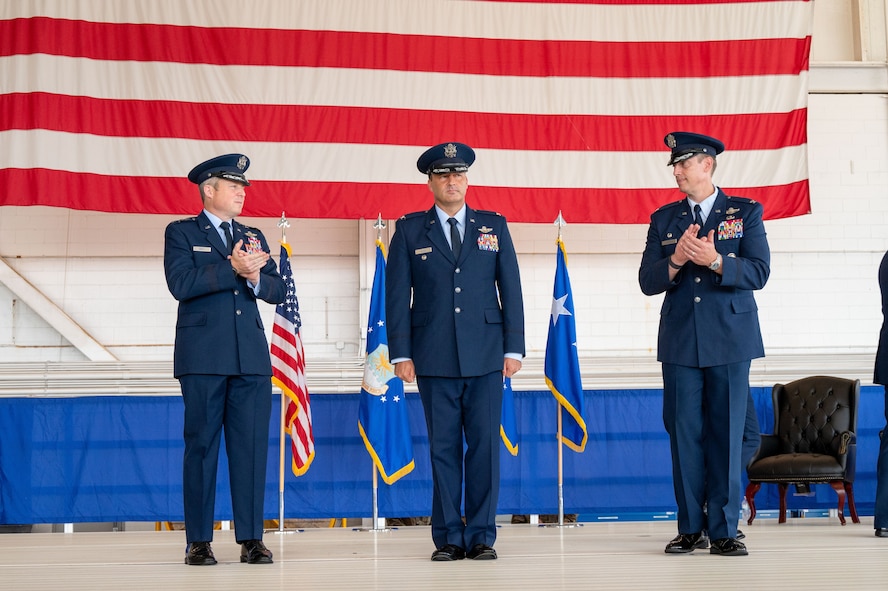 U.S. Air Force Lt. Gen. Michael Conley, left, commander Air Force Special Operations Command, applauds Col. Zach Blom, center, incoming 492nd Special Operations Wing commander, alongside Col. Patrick Wnetrzak, right, outgoing 492nd SOW commander during a change of command ceremony at Hurlburt Field, Florida, June 27, 2025