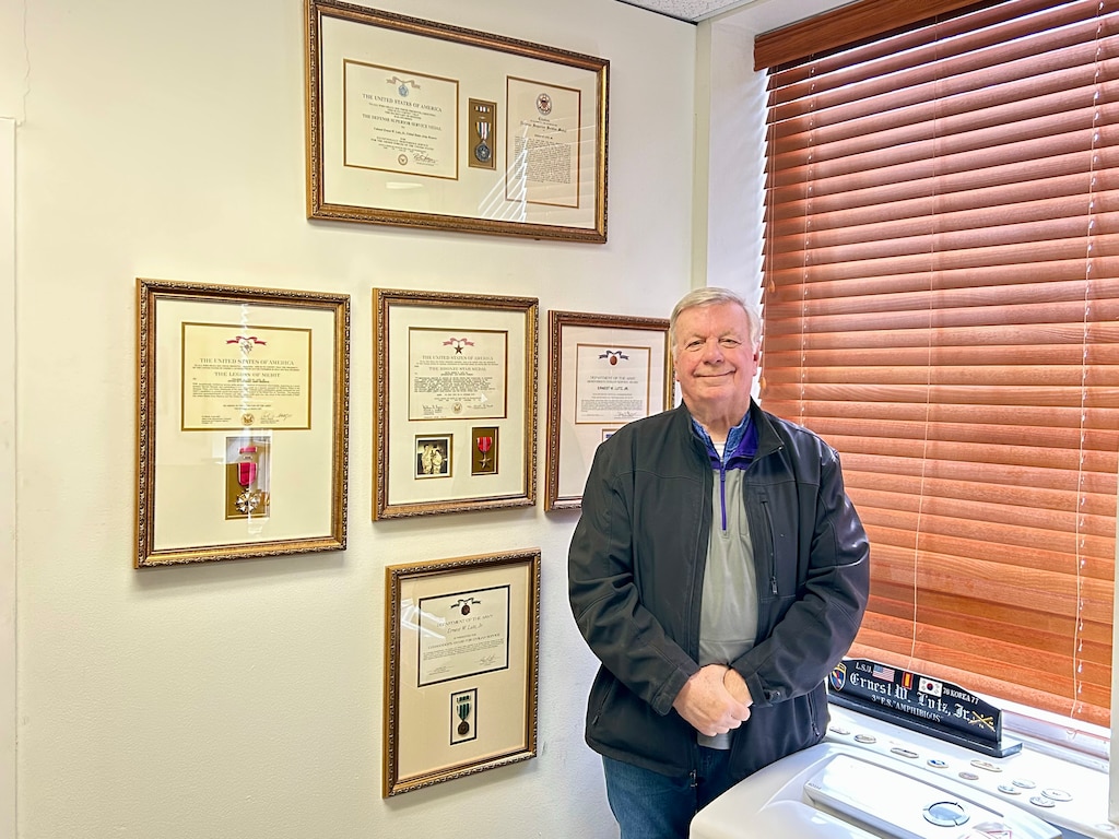 After more than 50 years of government service, Ernest 'Butch' Lutz retired from ERDC in February 2025 after serving as ERDC’s chief of internal review since 2012. He is pictured here with some of his many accolades—including the Defense Superior Service Medal, Legion of Merit, Bronze Star Medal, and the Department of the Army Meritorious Civilian Service Award.