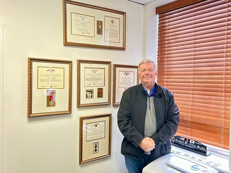 After more than 50 years of government service, Ernest 'Butch' Lutz retired from ERDC in February 2025 after serving as ERDC’s chief of internal review since 2012. He is pictured here with some of his many accolades—including the Defense Superior Service Medal, Legion of Merit, Bronze Star Medal, and the Department of the Army Meritorious Civilian Service Award.