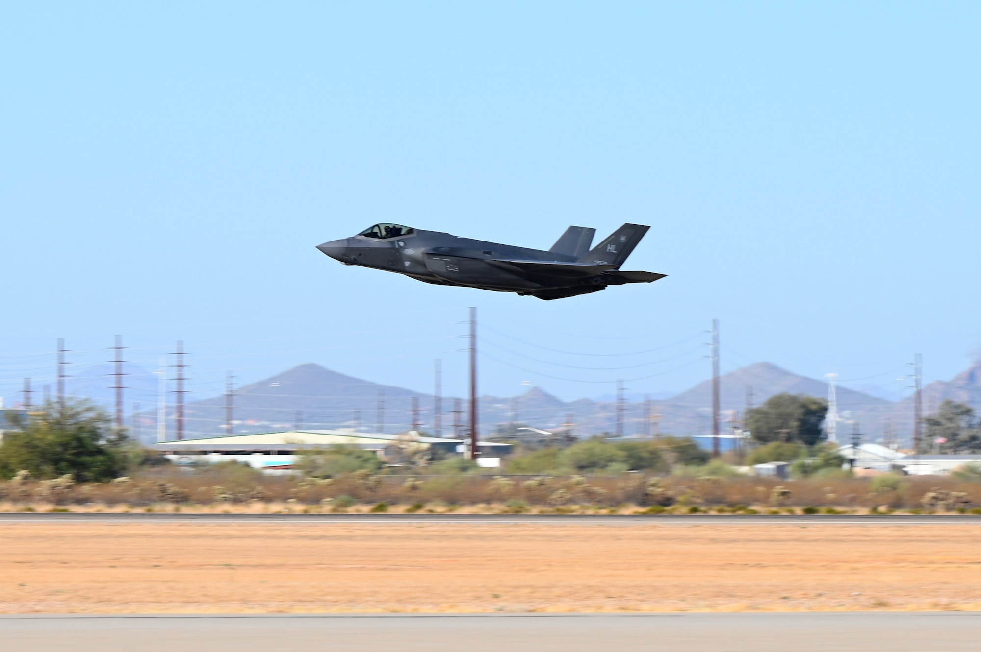 A U.S. Air Force F-35A Lightning II aircraft takes off on the runway before performing an aerial demonstration during Heritage Flight Training Course at Davis-Monthan Air Force Base, Arizona, March 1, 2025. The Lightning II is a stealthy, multirole, all-weather air-to-air and surface attack fighter. (U.S. Air Force photo by Senior Airman Andrew Garavito)