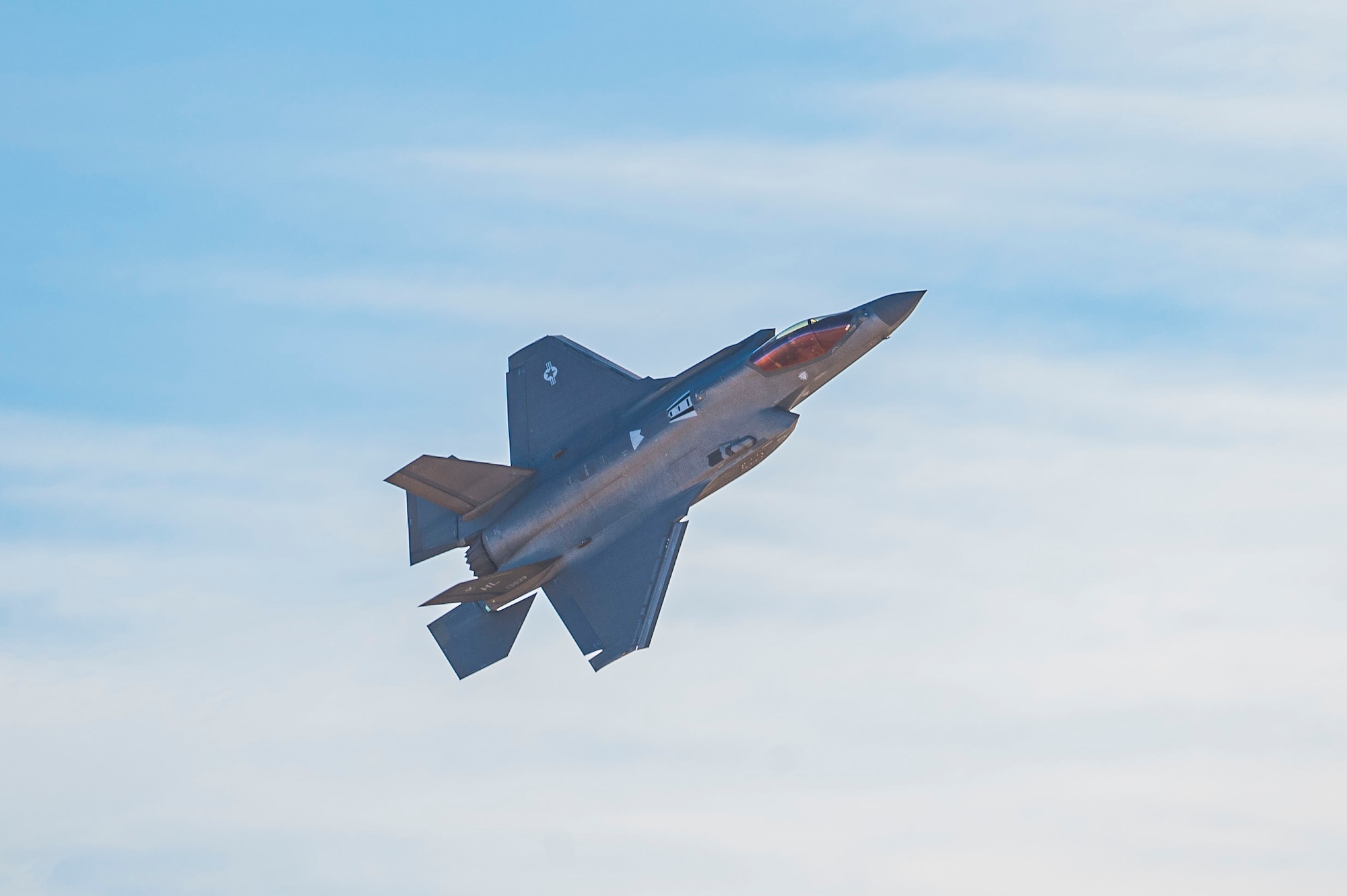 A U.S. Air Force F-22 Raptor aircraft flies during the Heritage Flight Training Course at Davis-Monthan Air Force Base, Arizona, Mar. 1, 2025. The F-22 Demonstration Team is made up of 12 active-duty Air Force personnel who travel around the country, as well as internationally, to recruit, retain and inspire the next generation of Airmen. (U.S. Air Force photo by Airman Samantha Melecio)