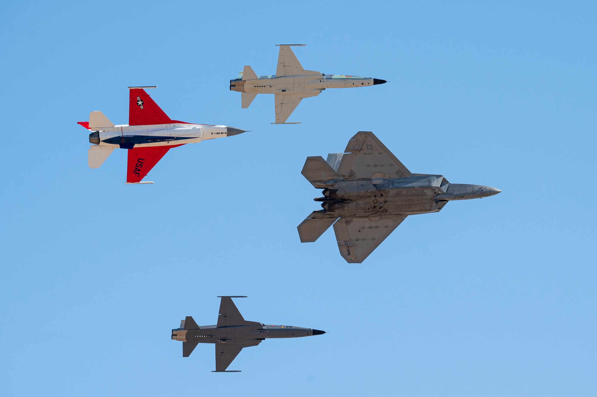 A U.S. Air Force F-22 Raptor aircraft, F-16 Fighting Falcon aircraft and Northrop F-5 aircraft execute a formation flight during Heritage Flight Training Course at Davis-Monthan Air Force Base, Arizona, Mar. 1, 2025. The Air Force Heritage Flight Foundation celebrates U.S. air power history by providing 50 to 70 annual Heritage Flight demonstrations around the world. (U.S. Air Force photo by Airman Samantha Melecio)