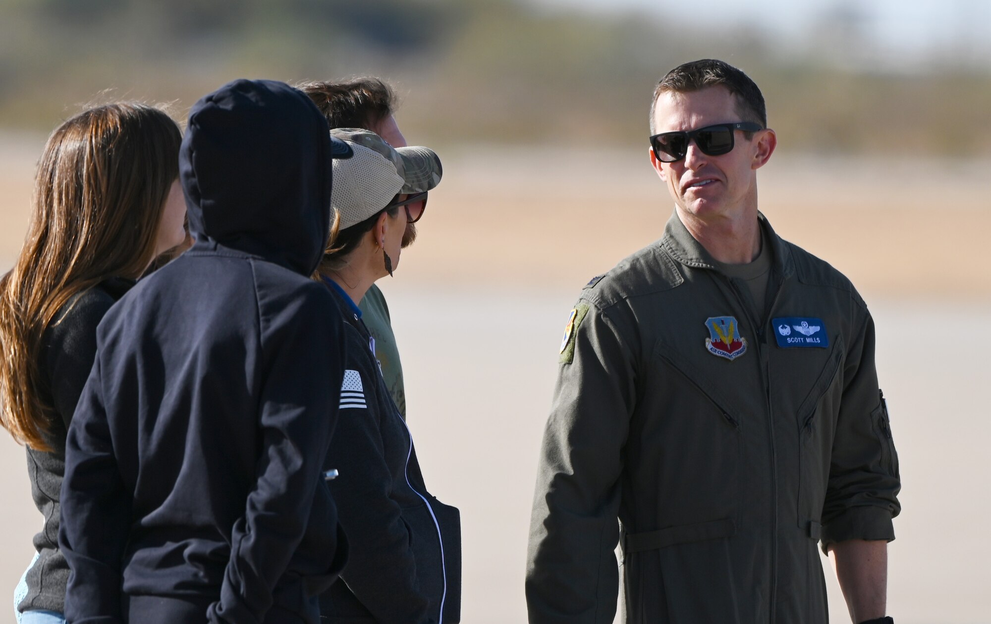 U.S. Air Force Col. Scott Mills, 355th Wing commander, watches demonstration teams perform during the Heritage Flight Training Course at Davis-Monthan Air Force Base, Arizona, March 1, 2025.  Heritage flights are flown with past and current U.S. Air Force aircraft to honor the past, present and future of American airpower. (U.S. Air Force photo by Senior Airman Andrew Garavito)