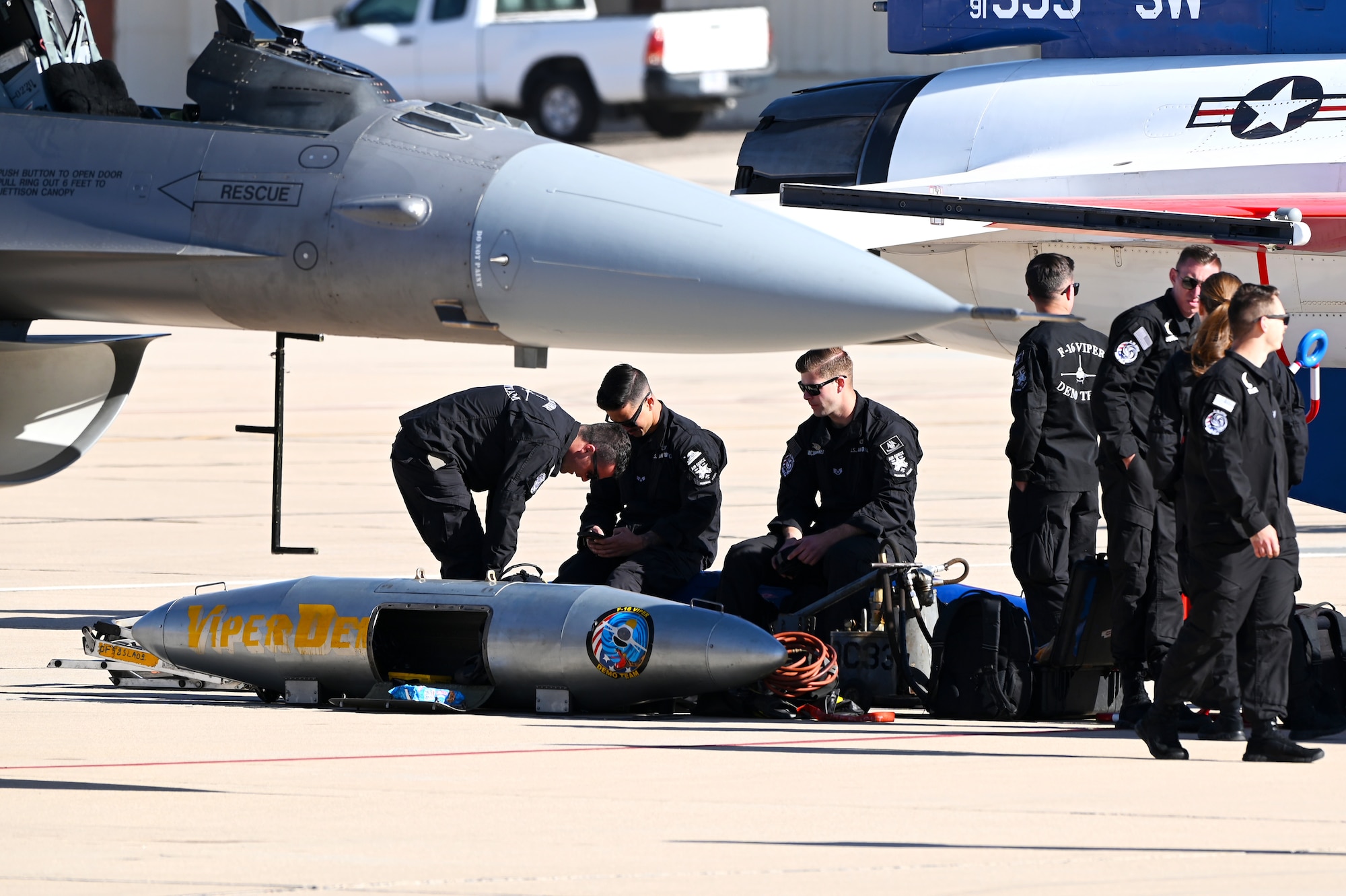 U.S. Air Force Airmen from the F-16 Viper Demonstration Team perform preflight checks during Heritage Flight Training Course at Davis-Monthan Air Force Base, Arizona, March 1, 2025. Heritage flights are flown with past and current U.S. Air Force aircraft to honor the past, present and future of American airpower. (U.S. Air Force photo by Senior Airman Andrew Garavito)