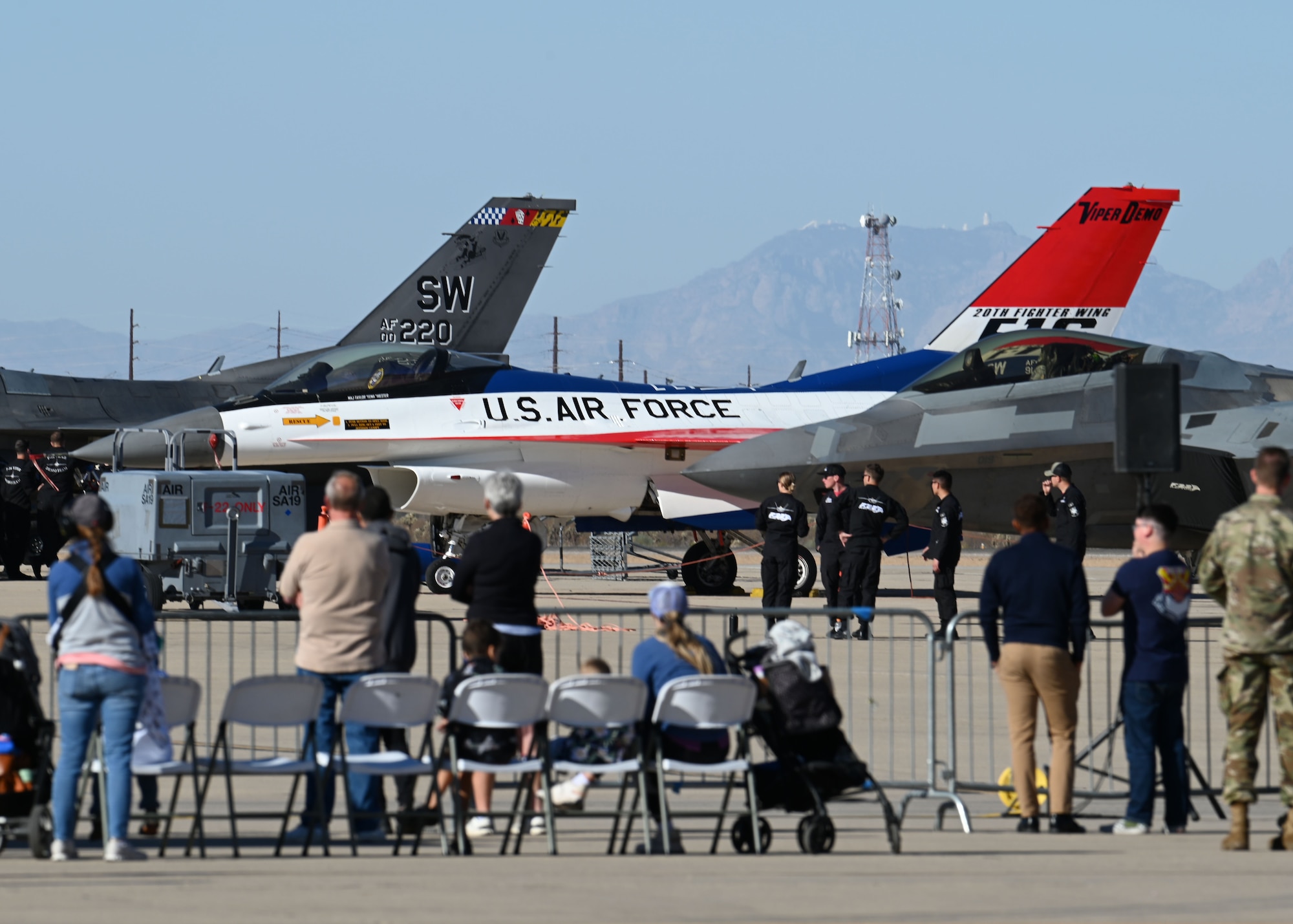 Members of the 355th Wing gather to watch the Heritage Flight Training Course at Davis-Monthan Air Force Base, Arizona, March 1, 2025. The Air Combat Command aircraft flying in this year’s training were the F-35 Lightning II, the F-22 Raptor, F-16 Fighting Falcon, F-105 Thunderchief, P-51 Mustang and the P-38 Lightning. (U.S. Air Force photo by Staff Sgt. Abbey Rieves)