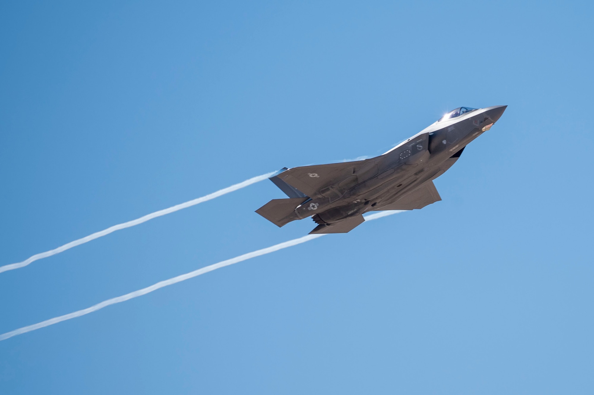 A U.S. Air Force F-35A Lightning II aircraft flies over Davis-Monthan Air Force Base, Arizona, March 2, 2025. The F-35A is designed to provide the pilot with unsurpassed situational awareness, positive target identification and precision strike in all weather conditions. (U.S. Air Force photo by Airman Samantha Melecio)