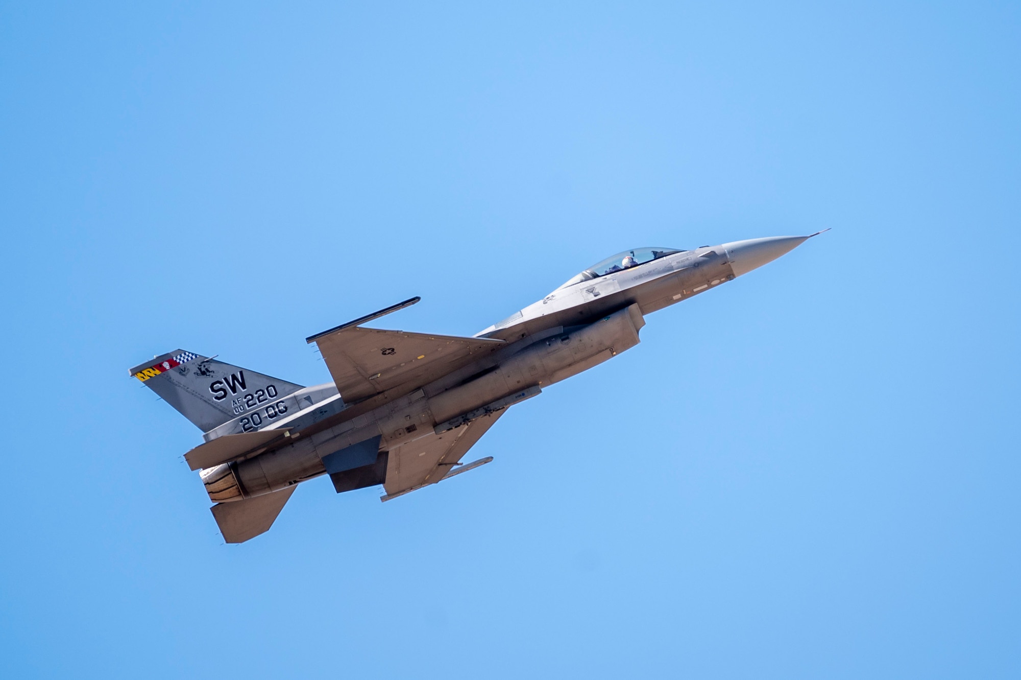 U.S. Air Force Maj. Taylor “FEMA” Heister, F-16 Demonstration Team pilot and commander, flies over the Heritage Flight Training Course at Davis-Monthan Air Force Base, Arizona, March 2, 2025. In an air-to-surface role, the F-16 can fly more than 500 miles, deliver its weapons with superior accuracy, defend itself against enemy aircraft, and return to its starting point. (U.S. Air Force photo by Airman Samantha Melecio)