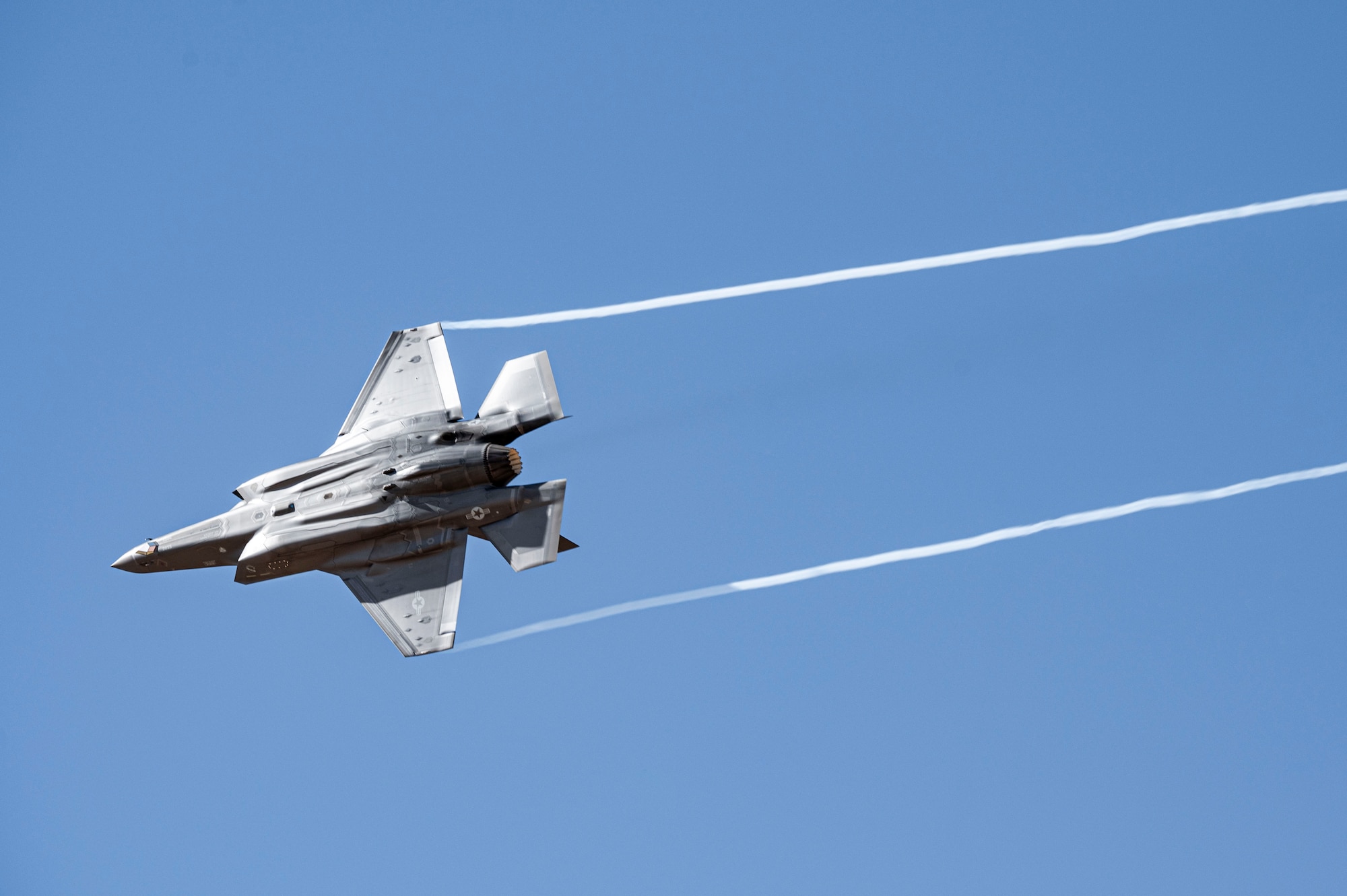U.S. Air Force Maj. Melanie “MACH” Kluesner, F-35A Lightning II Demonstration Team commander, flies over Davis-Monthan Air Force Base, Ariz., Arizona, March 2, 2025. The F-35A Demonstration Team travels around the country, as well as internationally, to recruit, retain and inspire the next generation of Airmen. (U.S. Air Force photo by Airman Samantha Melecio)