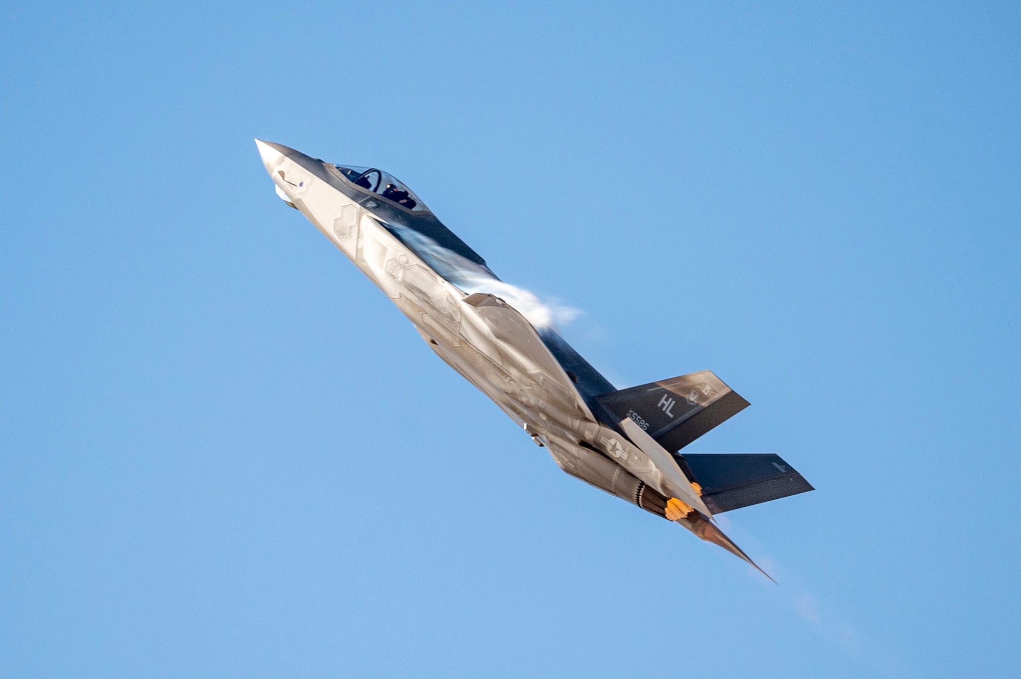 A U.S. Air Force F-35A Lightning II aircraft soars over the flightline during the Heritage Flight Training Course at Davis-Monthan Air Force Base, Arizona, March 2, 2025. As the Air Force’s newest fifth-generation fighter, the F-35A is a multi-role, all-weather, air-to-air and surface attack fighter. (U.S. Air Force photo by Airman Samantha Melecio)