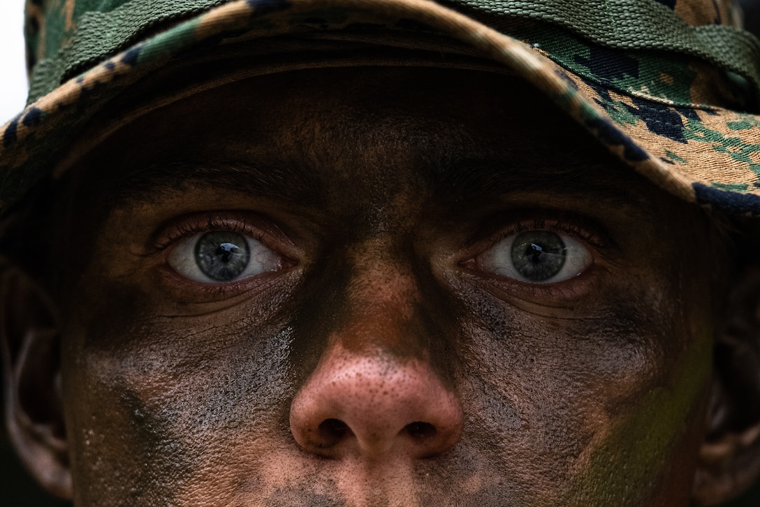 U.S. Navy Hospital Corpman 3rd Class Thaddeus Hyatt poses for a photo during a patrol at Camp Hansen, Okinawa, Japan, Feb. 3, 2025. Marines with 12th Marine Littoral Regiment refine their patrolling skills through offensive and defensive exercises, as well as reconnaissance operations, to enhance operational proficiency. By rehearsing patrols, these Marines improve their ability to move swiftly and efficiently, minimizing the risk of detection while strengthening unit cohesion and teamwork. Hyatt, a native of California, is a corpsman with 12th MLR, 3d Marine Division. (U.S. Marine Corps photo by Lance Cpl. Rodney Frye)