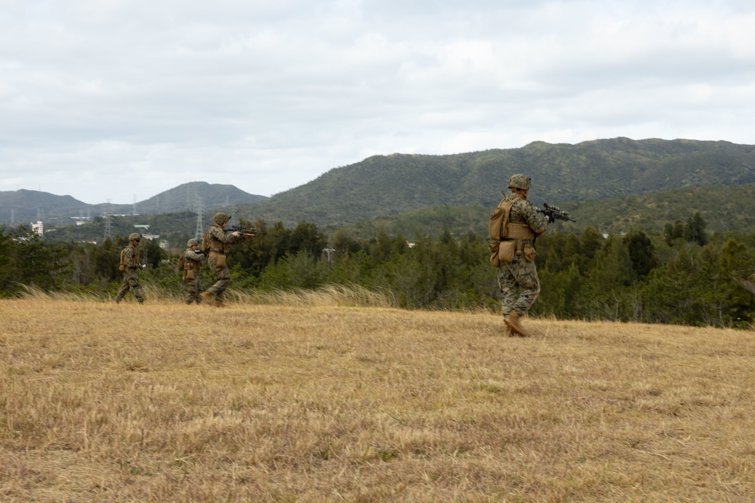 U.S. Marines buddy rush during a live-fire range on Camp Hansen, Okinawa, Japan, Feb. 14, 2025. The four-day field exercise focused on marksmanship skills and fire team fire and movement, strengthening the unit’s combat capabilities. Live-fire ranges give Marines the opportunity to engage and destroy targets in a dynamic environment, enhancing battlefield effectiveness. The Marines are with 12th MLR, 3d Marine Division. (U.S. Marine Corps photo by Cpl. Anna Geier)