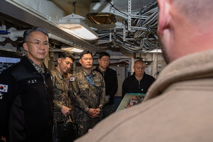 250301-N-GC571-1082 AT SEA (March 1, 2025) From left, Republic of Korea Rear Adm. Kim Ji-Hoon, director, Maritime Operations Center; Cmdr. Park Jaehyun, training officer, Republic of Korea Fleet Command; Cmdr. Yoo Sang-Hoon, Republic of Korea Fleet Command; Capt. Kim Jin-Tae, Republic of Korea Fleet Command; and Cmdr. Jimmy Suh, operations plans and readiness, Commander, U.S. Naval Forces Korea, tour Flight Deck Control aboard the Nimitz-class aircraft carrier USS Carl Vinson (CVN 70), March 1, 2025. Vinson, the flagship of Carrier Strike Group ONE, is underway conducting routine operations in the U.S. 7th Fleet area of operations. (U.S. Navy photo by Mass Communication Specialist Seaman Apprentice Pablo Chavez)
