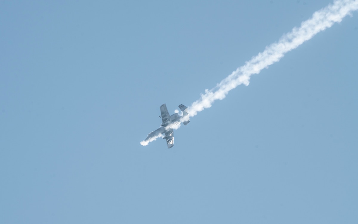 A U.S. Air Force A-10 Thunderbolt II assigned to the 25th Fighter Squadron fires its Gatling gun during a training sortie at Rodriguez Live Fire Complex, Republic of Korea, Feb. 24, 2025. The aircraft took part in a combined arms live fire exercise with U.S. and ROK Army assets to enhance interoperability in close air support operations. (U.S. Air Force photo by Staff Sgt. Ashley N. Mikaio)