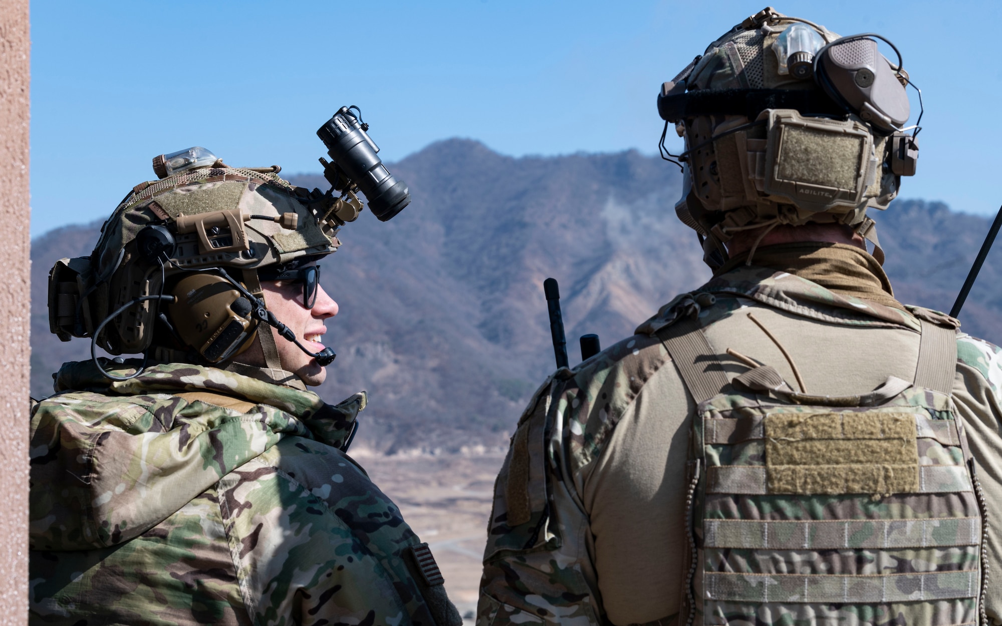 U.S. Air Force Senior Airman Christian Cornejo, left, and U.S. Air Force Senior Airman David Femal, 604th Air Support Operations Squadron tactical air control party operators, coordinate at Rodriguez Live Fire Complex, Republic of Korea, Feb. 24, 2025. The TACPs supported a combined arms live fire exercise incorporating multiple weapons systems to enhance close air support operations. (U.S. Air Force photo by Staff Sgt. Ashley N. Mikaio)