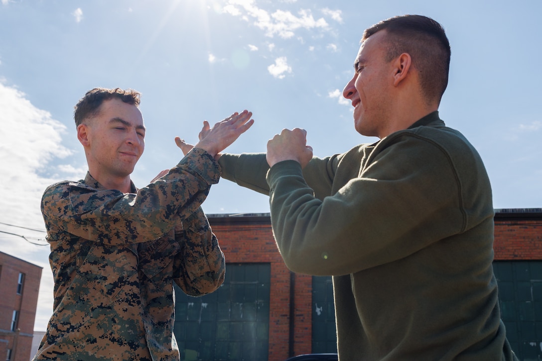 Lance Cpl. David Brandes, left, a combat photographer with Security Battalion, and Lance Cpl. Federico Marquez, right, a combat photographer with Security Battalion conduct defensive tactics during Security Augmentation Force training on Marine Corps Base Quantico, Virginia, Feb. 25, 2025. SAF provides Marines from other occupational specialties an opportunity to increase readiness and fulfill an additional billet which military police can utilize in case of emergencies. (U.S. Marine Corps photo by Lance Cpl. Braydon Rogers)